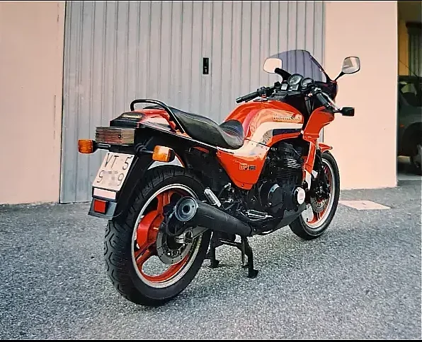 A kawasaki gpz 750, 1986, red, in good condition, three-quarter rear shot.