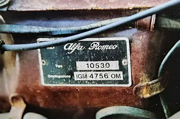 The metal approval and type plate on the Alfa Romeo GT Junior, in the engine compartment.